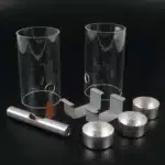 Dynamisk model af luftmasser indeholder klare cylindre, en stang, en kegle, metalbeslag og tre runde holdere i sort.